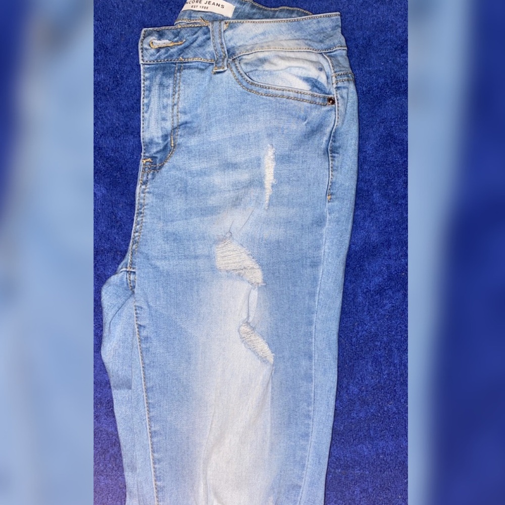 Light blue ripped jeans